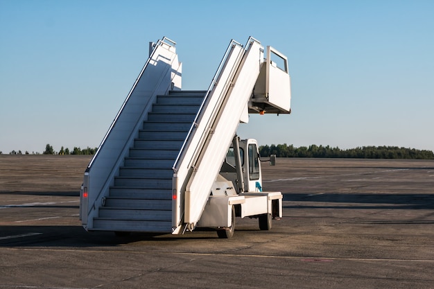 Passenger boarding stairs at the airport apron