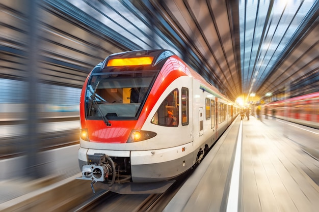 Passenger high speed train with motion blur in station.