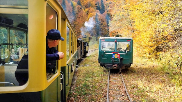 Passenger leaned out of the window of the steam train Mocanita, Romania