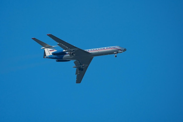 passenger plane departing from the airport against the blue sky