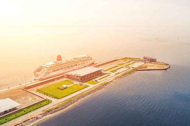 Passenger port with two cruise liners preparing for departure on a trip