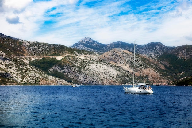 Passenger ship sails in the Adriatic sea with views of the mountains