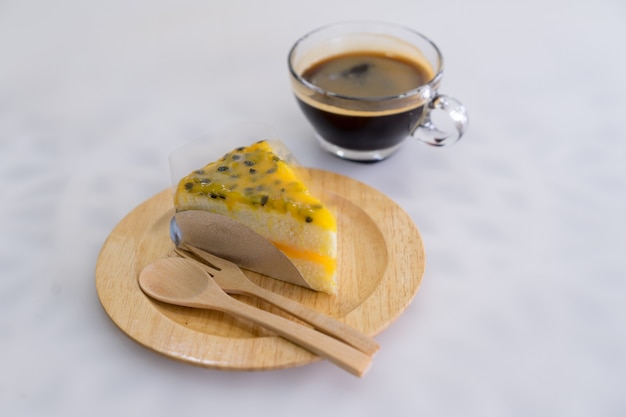 Passion Fruit Cake on wood plate