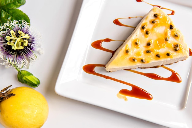 Passion fruit cheesecake on white background