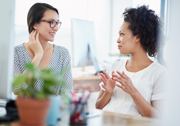 Passionate about their work Shot of two young female designers discussing work in the office