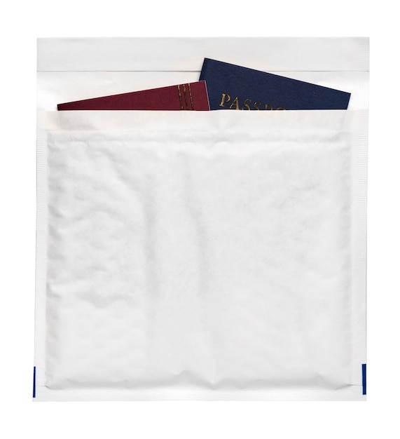 Passport spread in a white paper envelope travel concept