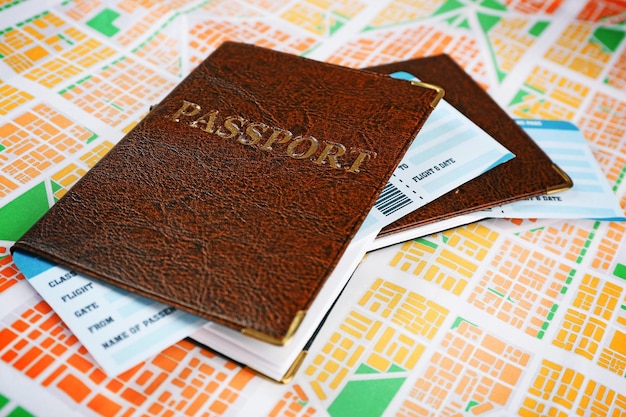 Passports with tickets on map background