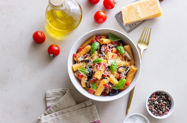 Pasta alla Norma with eggplant tomatoes cheese and basil Italian food Vegetarian food