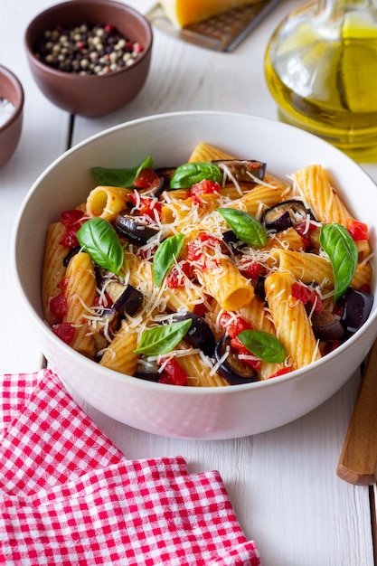 Pasta alla Norma with eggplant tomatoes cheese and basil Italian food Vegetarian food