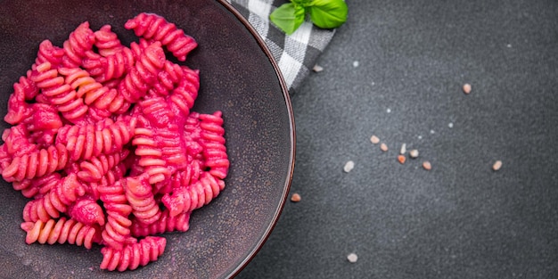 pasta beet sauce vegetable fusilli beetroo fresh food meal snack vegetarian food on the table