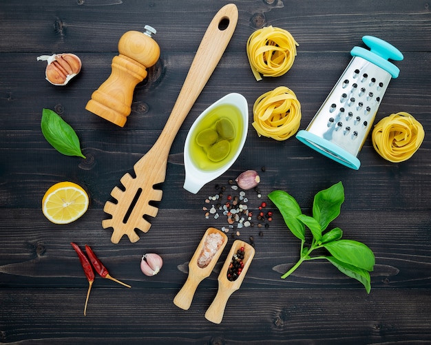 The  pasta on black wooden background.