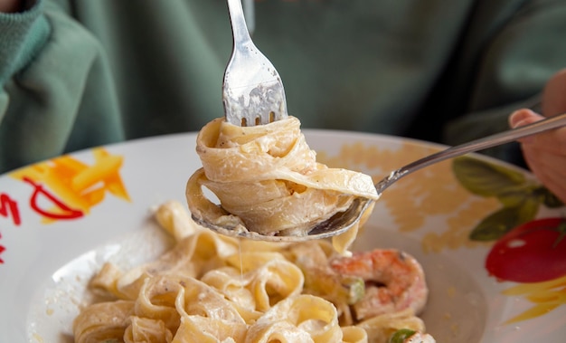 Pasta carbonara in a white plate Traditional Italian cuisine