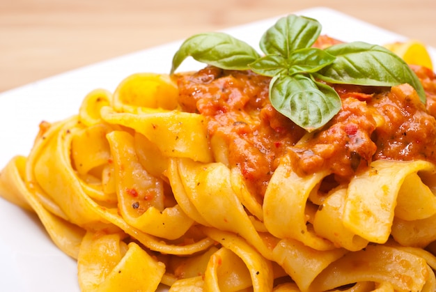 Pasta decorated with basil leaves