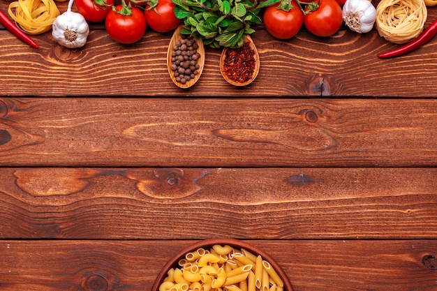 Pasta and ingredients with copyspace background. Top view.