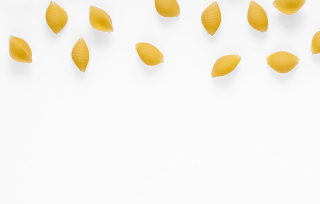 Pasta products in the form of a shell texture on a white background