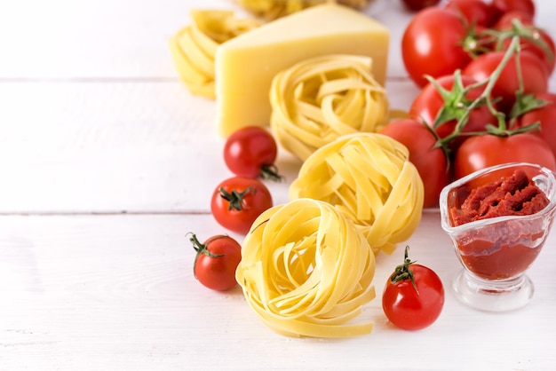 Pasta Products Tomato Cheese Raw Pasta Fusili Fettuccine Ingredients Italian Food White Background