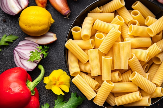 pasta rigatoni raw ingredient meal food snack on the table copy space food background rustic