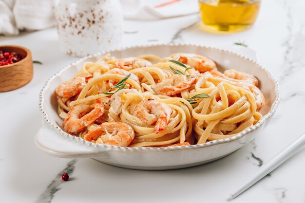 Pasta tagliatelle with shrimps in a creamy sauce