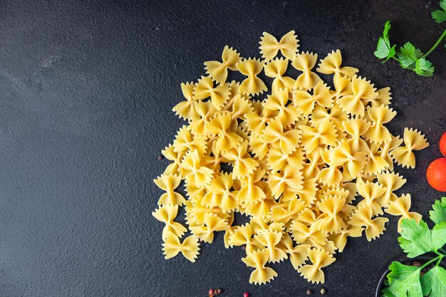 Pasta top view farfalle pasta italian traditional cooking ingredient raw food background