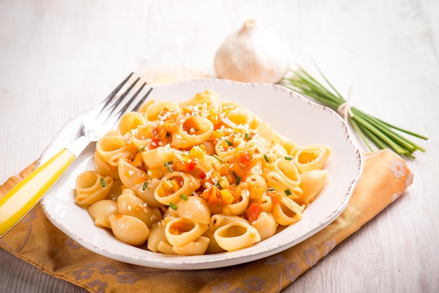 Pasta with capsicum chive and sesame seedsselective focus