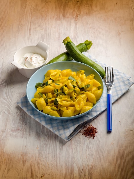 Pasta with cream sauce zucchinis and saffron