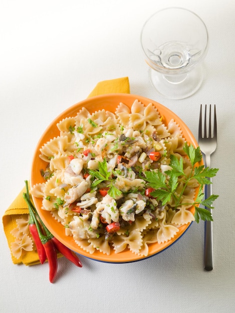 Pasta with hake hot chili pepper and parsley