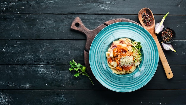 Pasta with pineapple and carrots In the plate Top view Free space for your text Rustic style