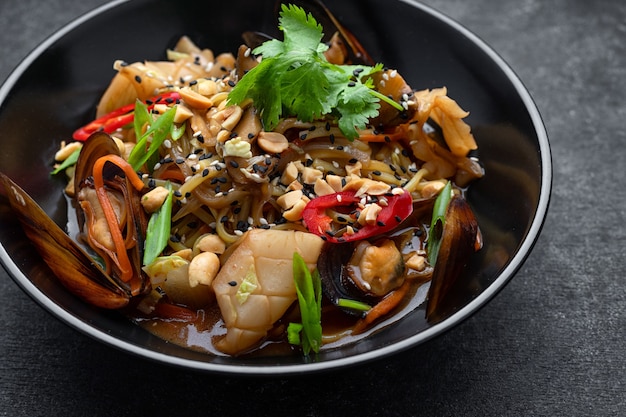 Pasta with seafood herbs sesame seeds and nuts