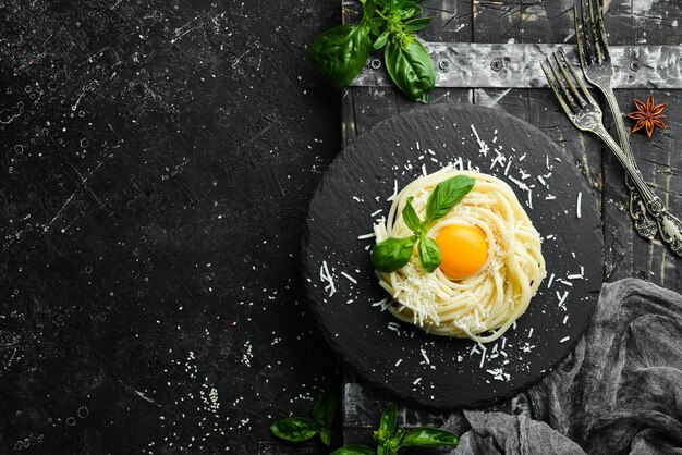 Paste carbonara with egg yolk Top view Italian food Free space for your text