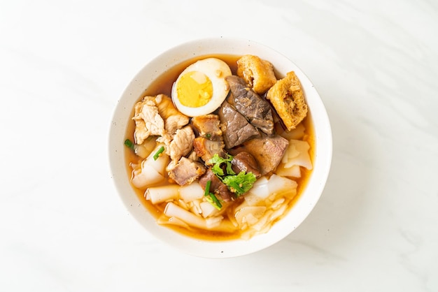 Paste of rice flour or boiled Chinese pasta square in clear soup