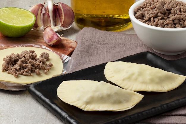 Pastel dough stuffed with minced beef