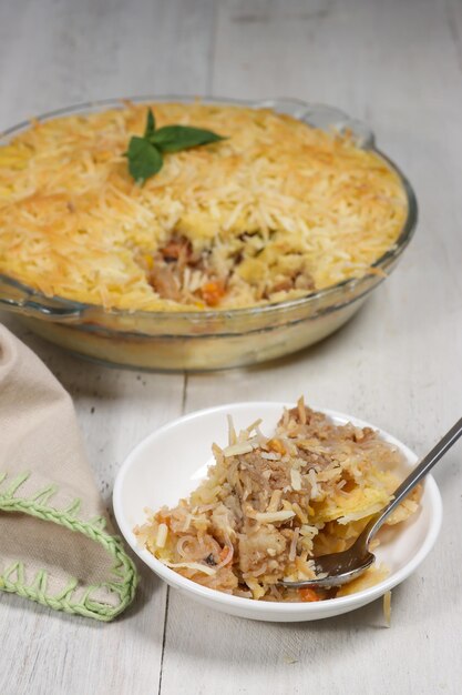 Pastel Tutup (Shepherd's Pie) is Traditional British pie, made from mashed potato and minced beef.