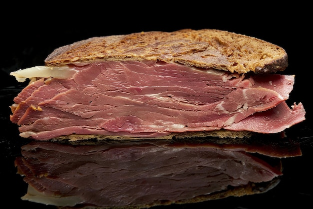 Pastrami on Rye black background photo