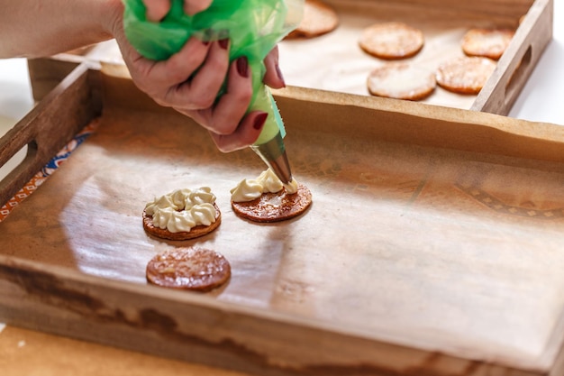 Pastry chef is decorating a millefeuille