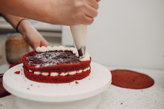 Pastry chef makes delicious red velvet cake Cooking and decorating dessert