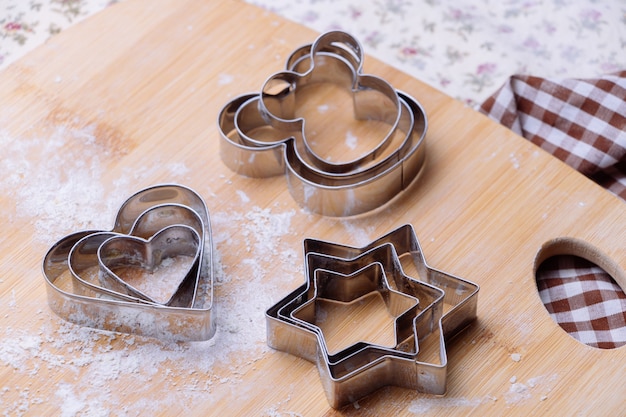 Pastry cutter on wooden board