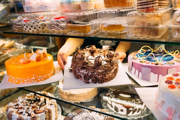 Pastry shop glass display with selection of cakes