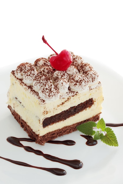 Pastry tiramisu with the mint and the cherries