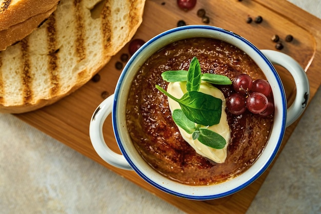 Pate with jam and butter in a plate. Close-up, selective focus