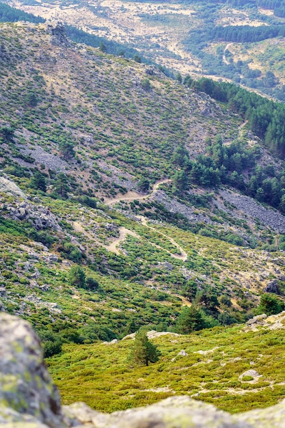 Path between mountains that goes down to the valley from the high mountain of the Community of Madrid Guadarrama