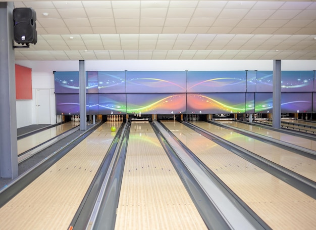 Paths with balls and pins for bowling. A fun game for the company.