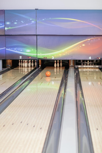 Paths with balls and pins for bowling. A fun game for the company.