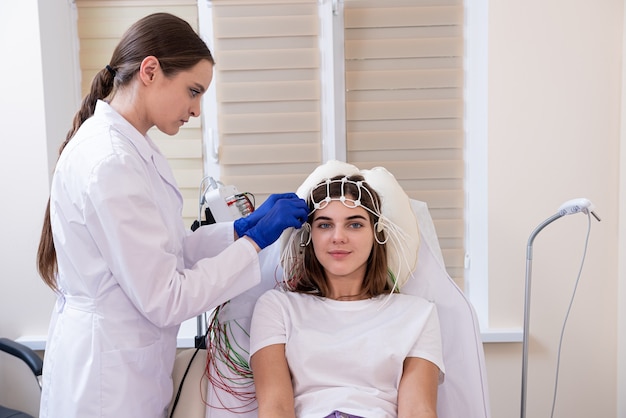 Patient brain testing using encephalography at medical center