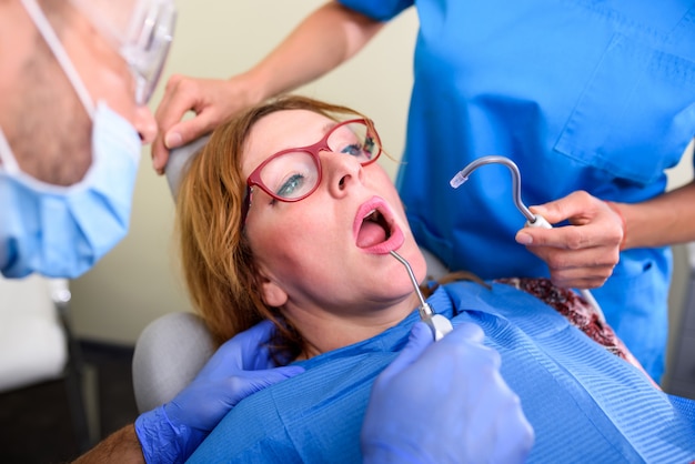 A patient getting attended and treatment in a dental studio