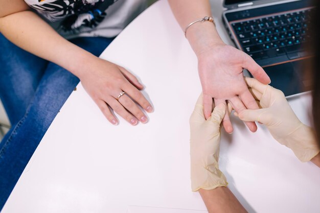 Patient at orthopedic medical exam in doctor's hospital office