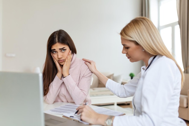 Patient receiving bad news She is desperate and crying Doctor support and comforting her patient with sympathy Don't worry this medical test is not so bad