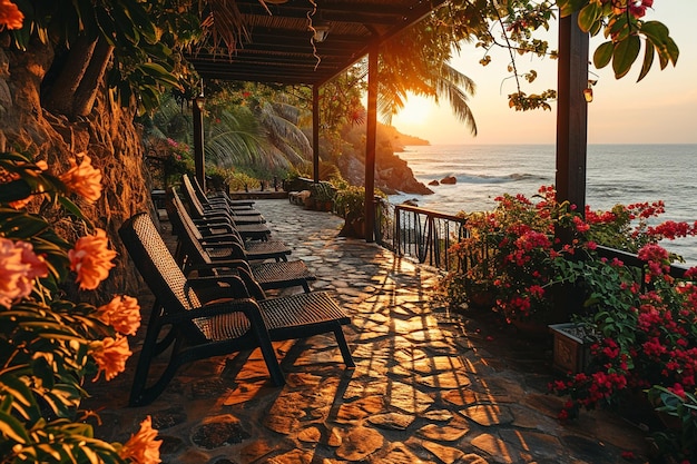 a patio with a view of the ocean and a sunset