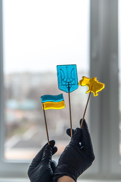 Patriotic lollipops in the form of ukrainian symbols