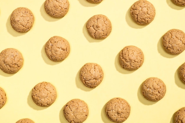 Pattern of cookies. Cookies on a yellow background. Flat lay