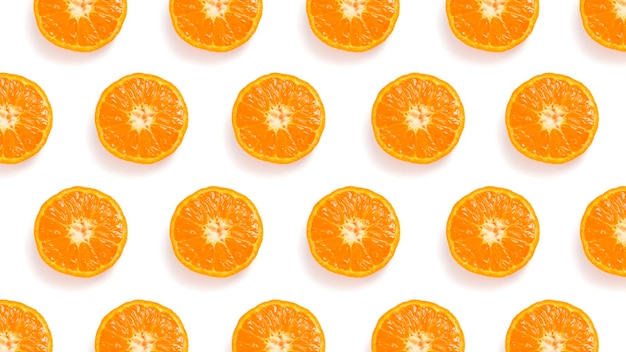 Pattern of cut tangerines on a white background